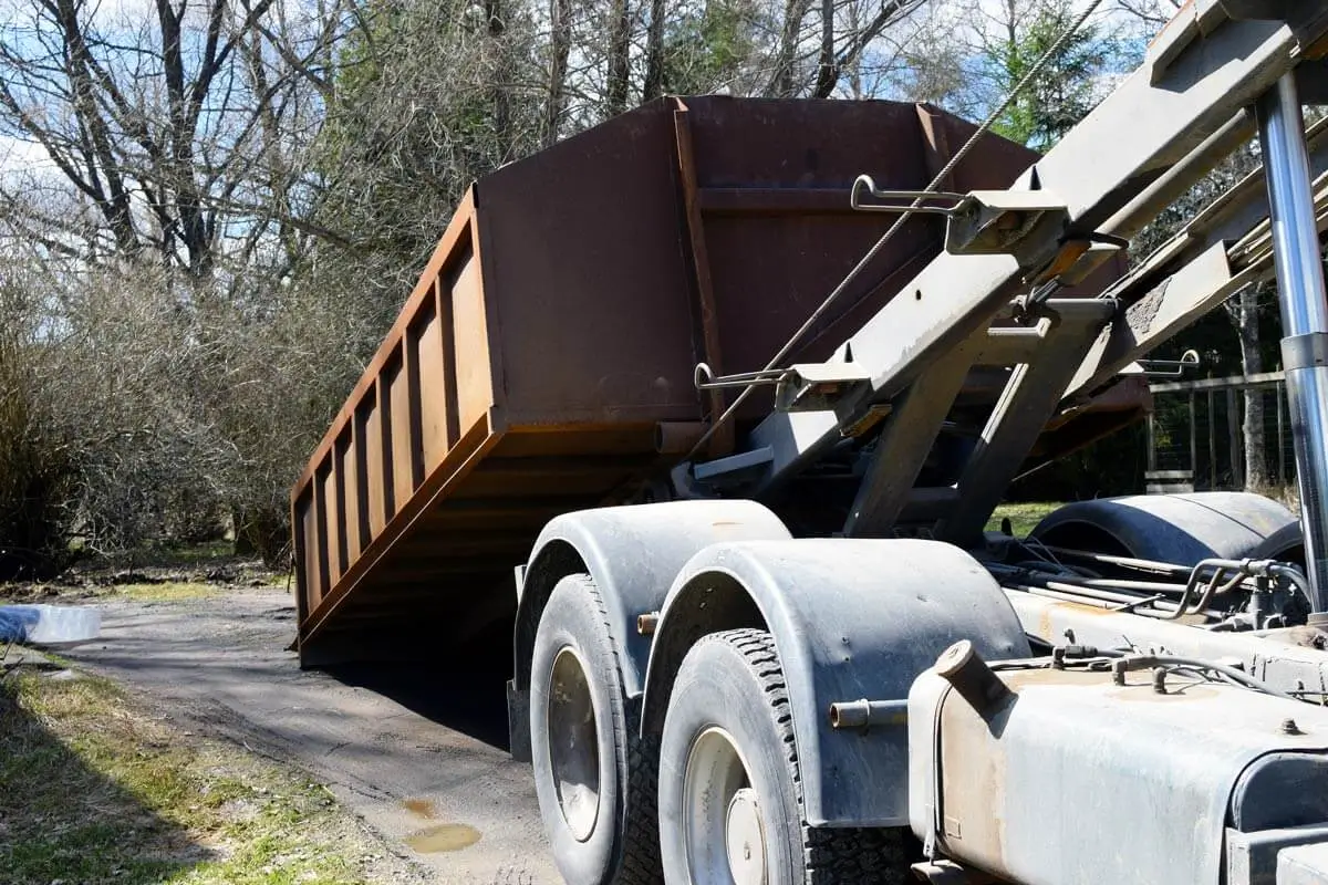 Roll-off dumpster being placed